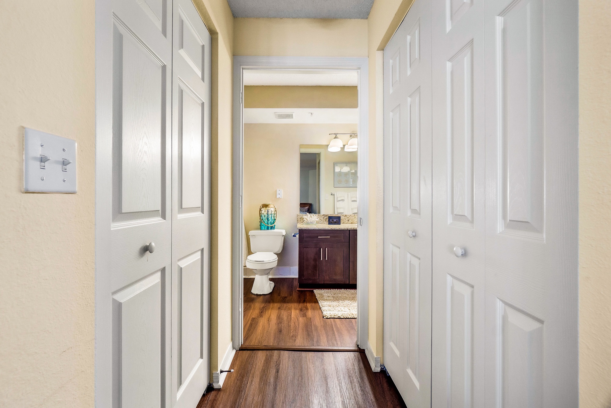 A white door is on the left and a white door is on the right.